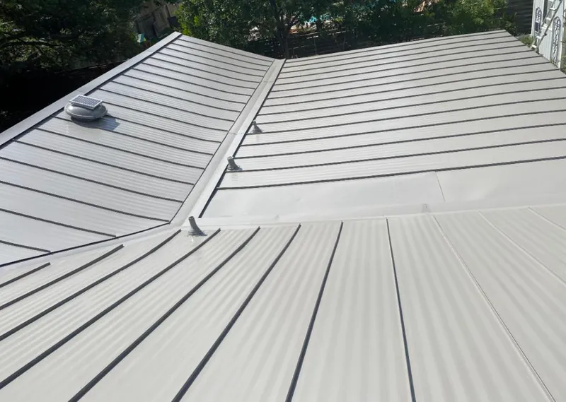 Solar attic fan installed on a metal roof for Roof Ventilation in Makakilo